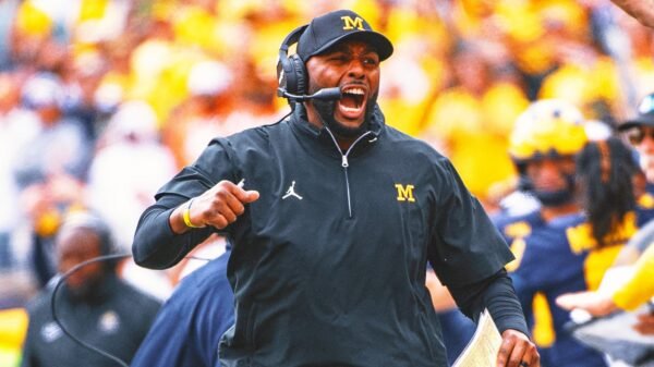 Michigan coach Sherrone Moore signs full contract, nearly 9 months after initial agreement