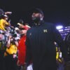 Michigan's Sherrone Moore has been coaching without a signed contract