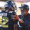 Colorado star Travis Hunter says coach Deion Sanders isn't going anywhere