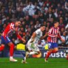 Real Madrid beats Atletico 2-1 in Champions League derby, Arsenal romps PSV