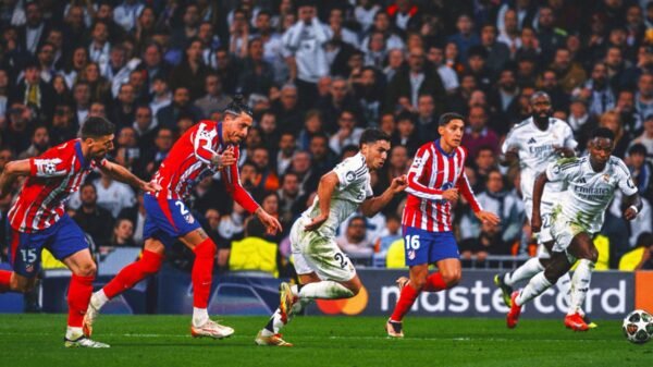 Real Madrid beats Atletico 2-1 in Champions League derby, Arsenal romps PSV